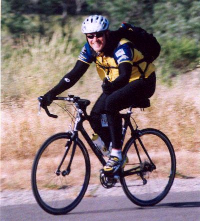 RDM riding along the highway on the Calfornia AIDSRide 2002